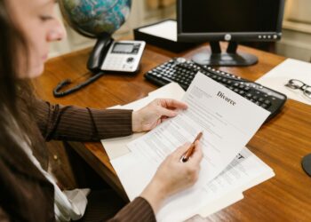 A lawyer reviewing documents related to a cryptocurrency lawsuit against W3C.