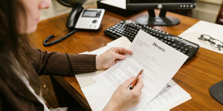 A lawyer reviewing documents related to a cryptocurrency lawsuit against W3C.