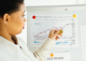 A financial advisor reviewing cryptocurrency options for 401(k) retirement plans.