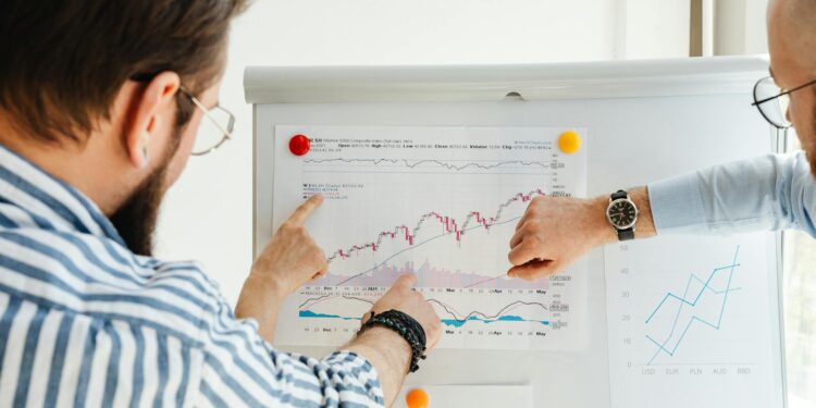 Aave team discusses crypto strategy in front of financial charts and data analytics.