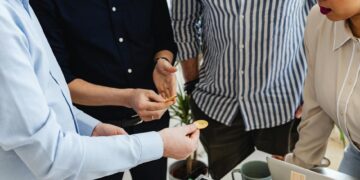 Developers brainstorming on cryptocurrency wallet features in a modern workspace.