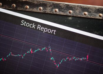 A stock market display showing fluctuating oil futures prices with a CFTC logo.