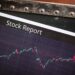 A stock market display showing fluctuating oil futures prices with a CFTC logo.