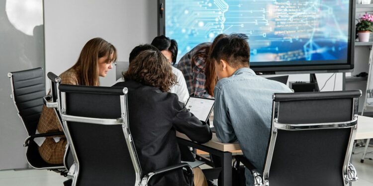 People at a conference discussing blockchain and AI technology integration.