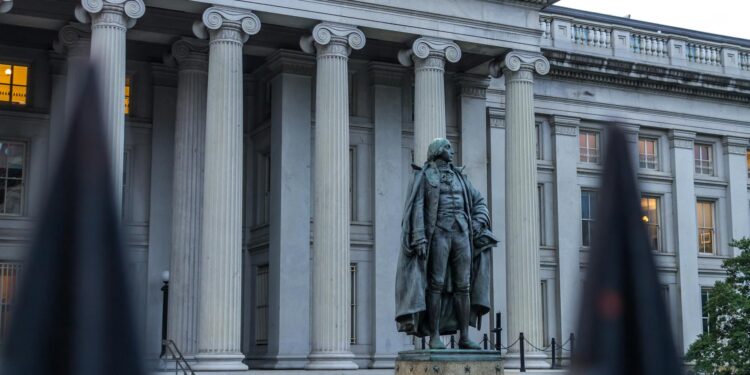 US Treasury building with cryptocurrency symbols, highlighting new AML regulations for stablecoins.