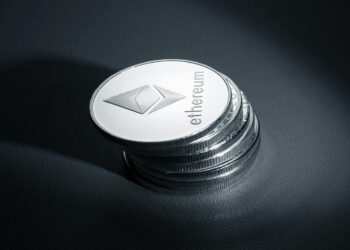 Ethereum coins stacked with a digital wallet interface displaying a large transaction amount.