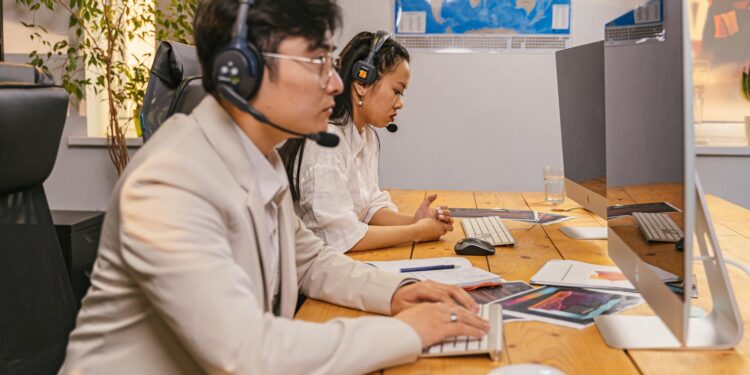 North Korean workers at computers involved in cryptocurrency operations.