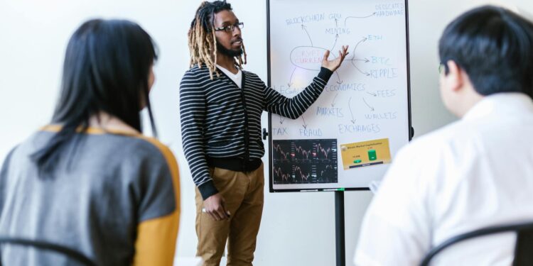 A diverse group of professionals engages in a blockchain education workshop.