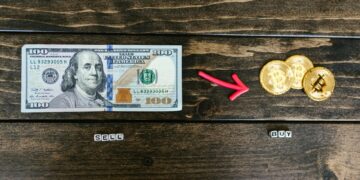 Cryptocurrency exchange logo surrounded by dollar signs and blockchain graphics.