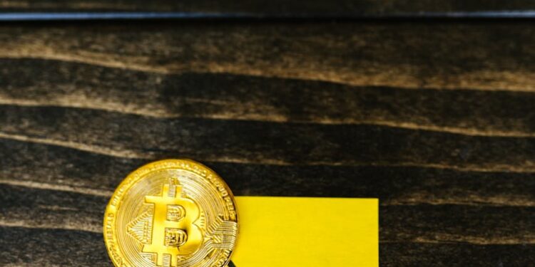 Stacks of cryptocurrency tokens with a downward arrow, symbolizing market decline.