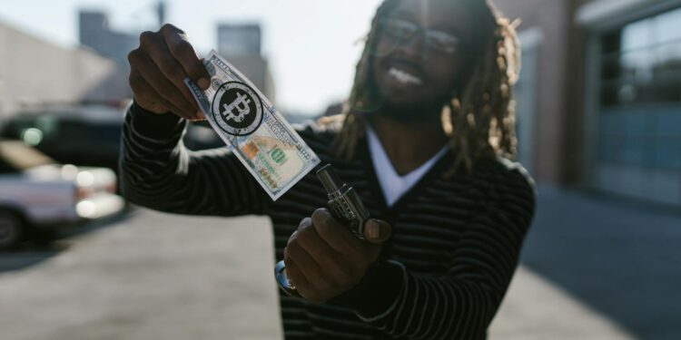 A smiling man in a suit holding a large check labeled $5.4 million with a blockchain symbol.