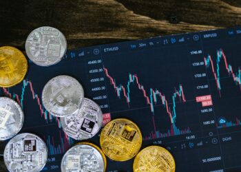 A digital illustration of blockchain technology and financial graphs representing tokenization.