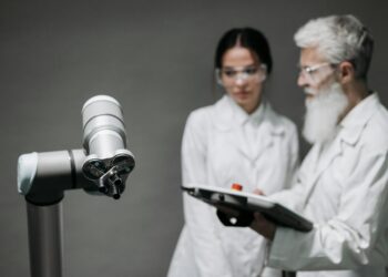 A group of engineers examining advanced robotics powered by new trillion-parameter AI technology.