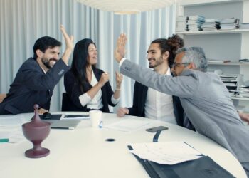 Coinshares executives ring the Nasdaq bell, celebrating their SPAC merger success.