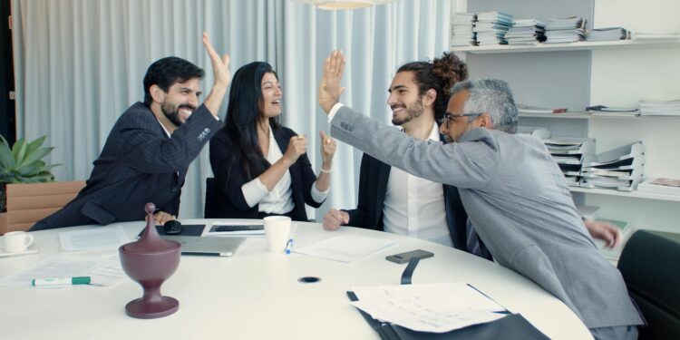 Coinshares executives ring the Nasdaq bell, celebrating their SPAC merger success.