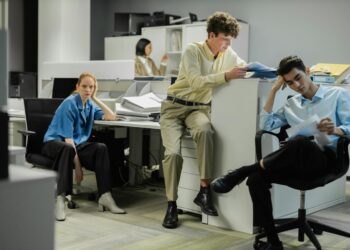 MARA employees in an office setting, highlighting the impact of workforce reductions in finance.