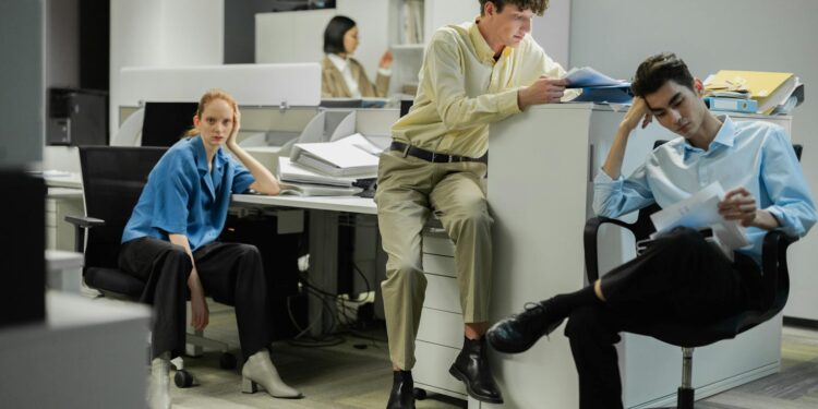 MARA employees in an office setting, highlighting the impact of workforce reductions in finance.