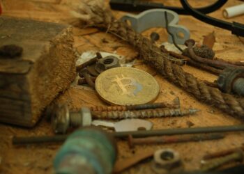 Illustration of a broken lock against a backdrop of cryptocurrency symbols, highlighting security issues.