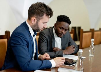 Bank representatives discussing digital currency integration at a conference table.