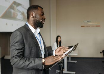 Sunil Sabharwal, in business attire, speaks at a finance conference.