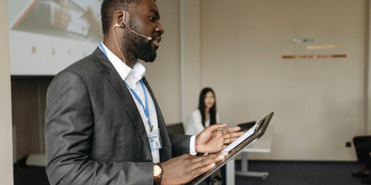 Sunil Sabharwal, in business attire, speaks at a finance conference.