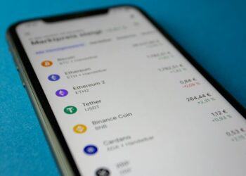 A Tether logo is prominently displayed on a digital currency trading platform screen.