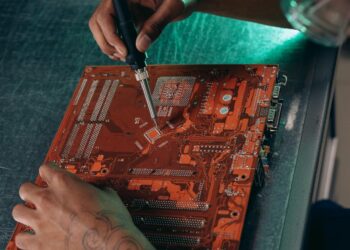 Engineers working on AI chip designs in a tech lab, showcasing advanced computing hardware.