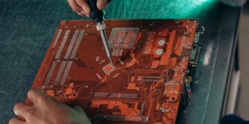 Engineers working on AI chip designs in a tech lab, showcasing advanced computing hardware.