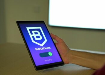 A person examining a digital wallet interface displaying various cryptocurrencies.