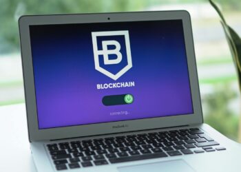 Coinbase logo overlaying a digital representation of AI and blockchain technology.