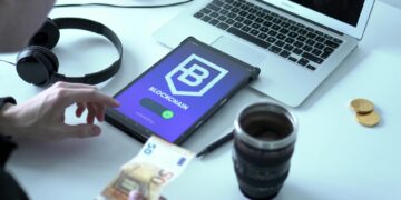 A digital euro coin displayed with financial charts and digital payment graphics.