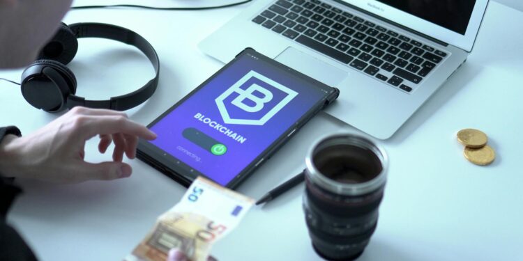 Two professionals discussing AI payments with blockchain graphics in the background.