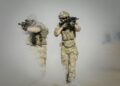 Troops using advanced AI technology for military targeting operations.