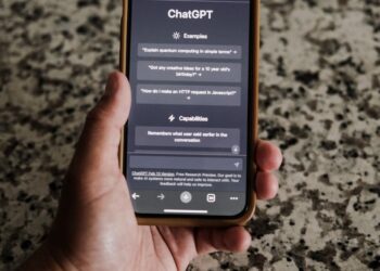 User entering security settings on a digital device with ChatGPT interface visible.