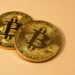 SBI Holdings executives discuss Bitbank acquisition amidst cryptocurrency market changes.