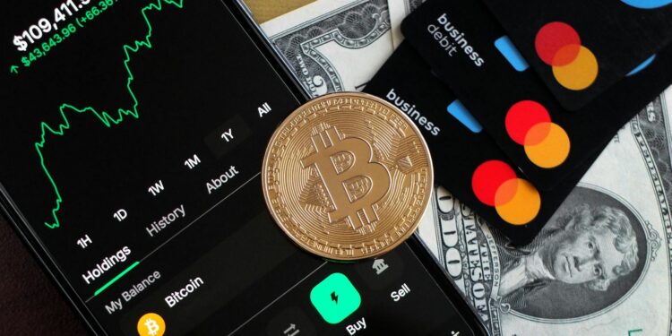 A user holding a credit card with cryptocurrency icons against a digital finance backdrop.