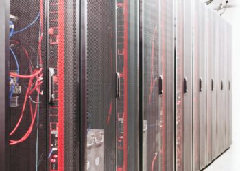 Data center with servers, highlighting crypto market fluctuations and financial operations.