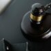 A gavel rests on financial documents, symbolizing legal settlement in crypto fraud case.
