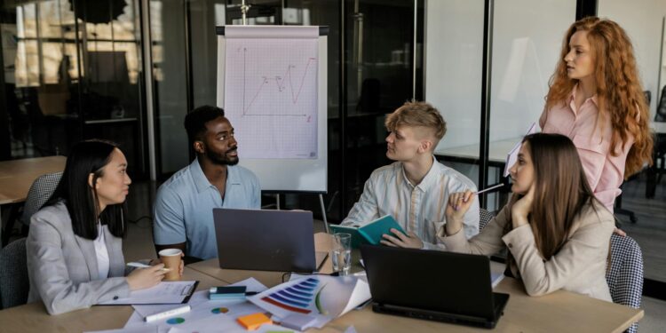 A group of diverse professionals discusses regulations on prediction markets in a conference room.