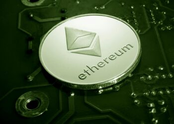 Crypto enthusiasts gather around screens displaying MegaETH token launch details and Ethereum graphics.