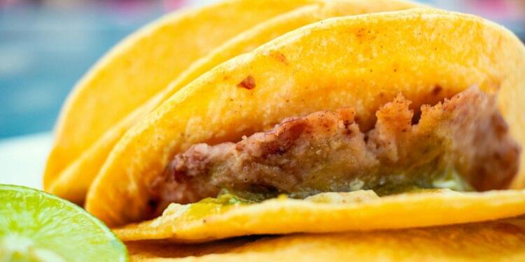 Attendees enjoying tacos and discussing cryptocurrency at Taco Tech Tuesday event.