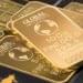 Tether executive discussing investment strategy with gold bars in the background.
